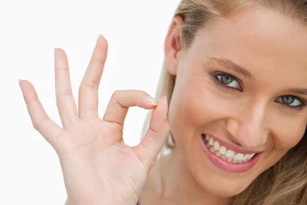 Close-up of a young woman gesturing to approve — Stock Photo, Image