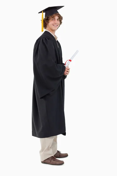 Visão de perfil de um estudante em roupão de pós-graduação — Fotografia de Stock