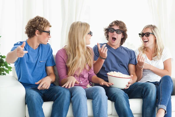 Friends laugh and joke around while watching a movie — Stock Photo, Image