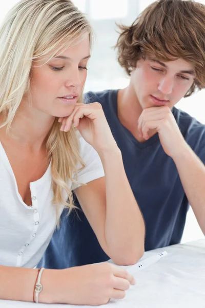 Close up of a worried couple waiting for a pregnancy test result — Stock Photo, Image