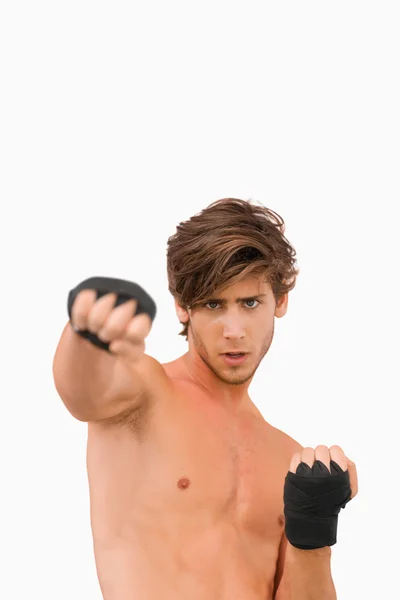 Martial arts fighter in offensive pose — Stock Photo, Image