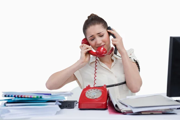 Stressed secretary answering the phones — Stock Photo, Image