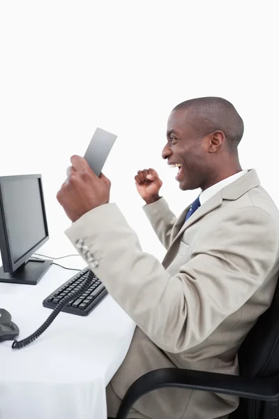 Portrait of a successful salesman holding a phone handset — Stock Photo, Image