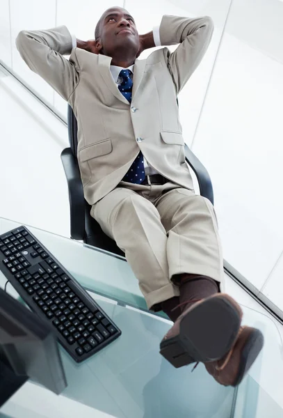 Portrait of a happy businessman relaxing — Stock Photo, Image