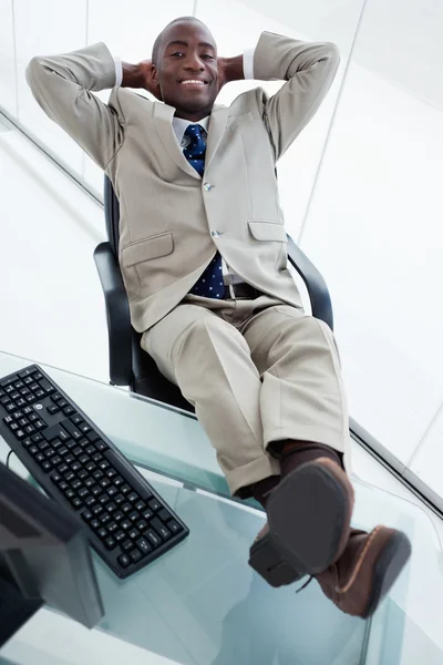 Portrait of a smiling businessman relaxing — Stock Photo, Image