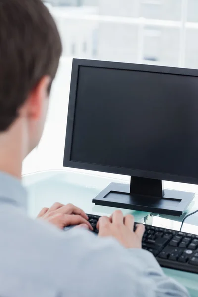 Back view of a businessman using a monitor — Stock Photo, Image