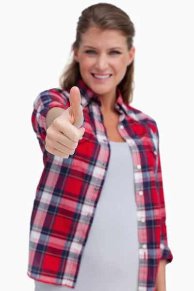 Portrait of a young woman with the thumb up — Stock Photo, Image
