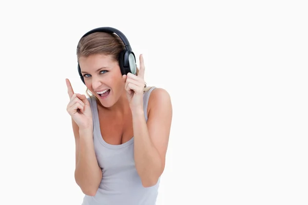 Cheerful woman dancing while listening to music — Stock Photo, Image