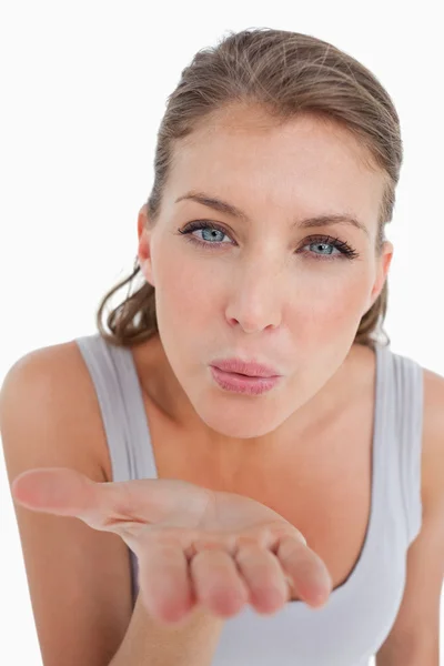 Portrait of a beautiful woman blowing a kiss — Stock Photo, Image