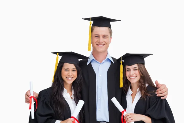 Three friends graduate from college together Royalty Free Stock Images