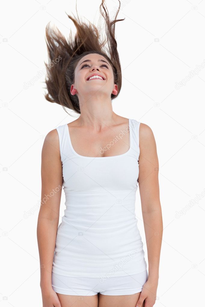 Smiling woman standing with her hair elevated — Stock Photo