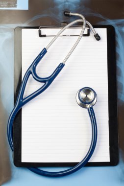 Note pad and blue stethoscope clipart