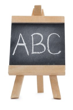 Chalkboard with the leters ABC written on it clipart