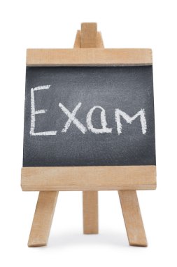 Chalkboard with the word exam written on it clipart