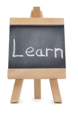 Chalkboard with the word learn written on it clipart