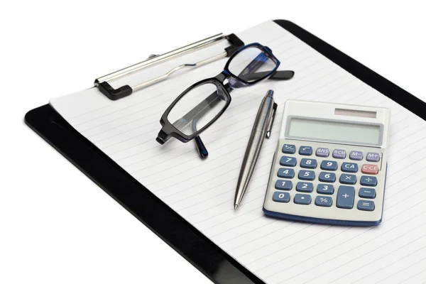 Angled note pad, pen, glasses and pocket calculator — Stock Photo, Image