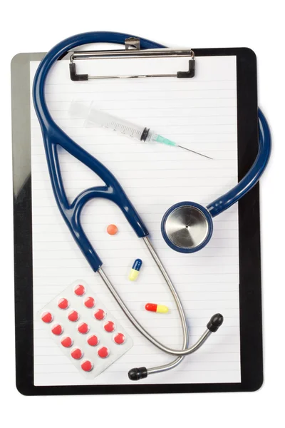 Note pad and stethoscope with color capsules and blister strip — Stock Photo, Image