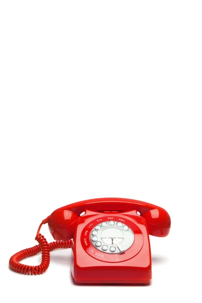 Антикварный красный телефон — стоковое фото