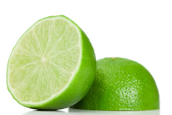 Green halved lemon — Stock Photo, Image