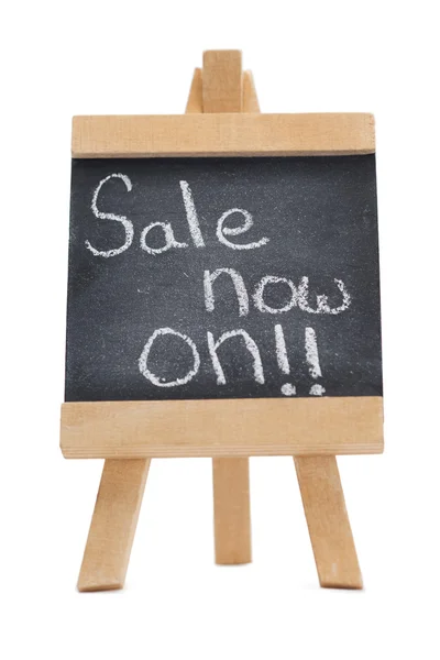 Chalkboard with the words sale now on written on it — Stock Photo, Image