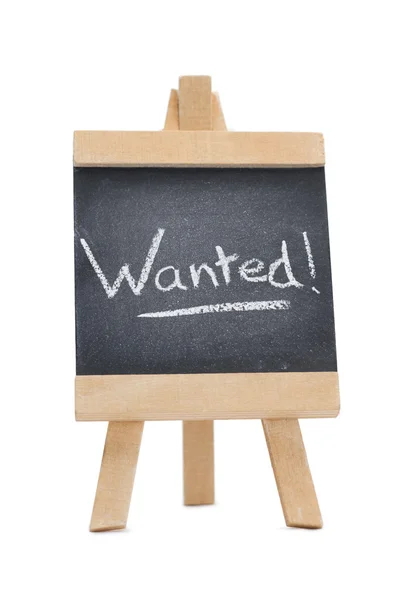 Chalkboard with the word wanted written on it — Stock Photo, Image