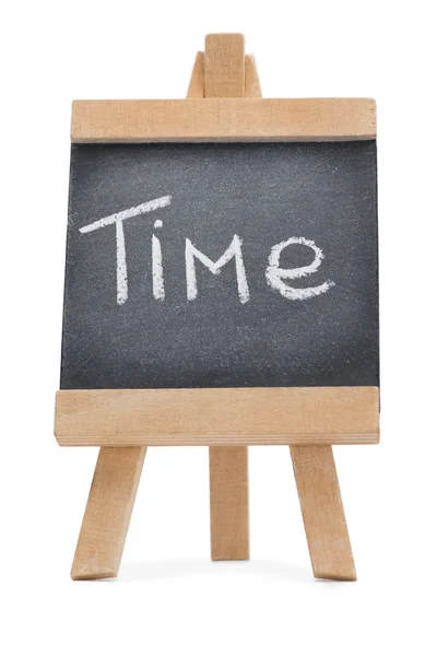 Крейдяна дошка зі словом "час", написаним на ній — стокове фото