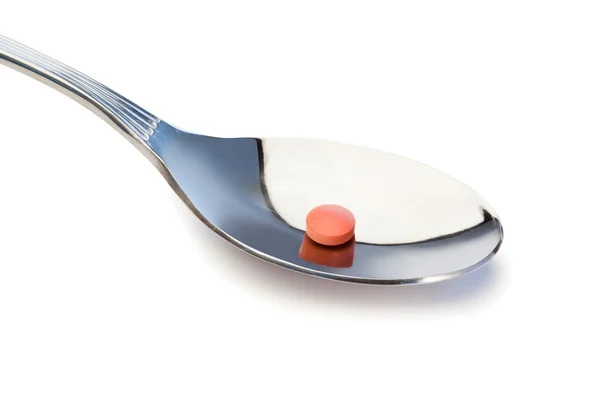 Pillola in un cucchiaio — Foto Stock