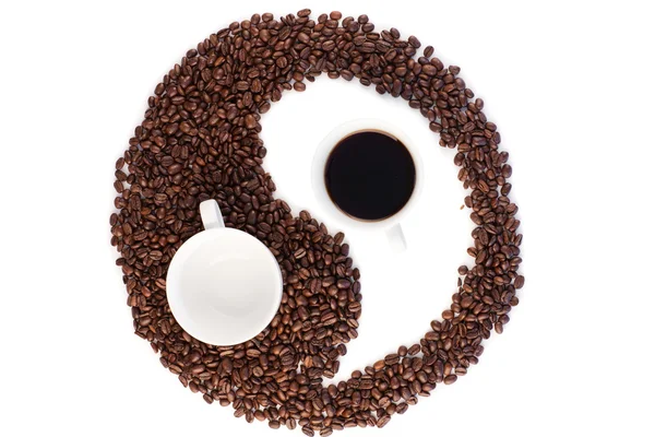 Símbolo marrón y blanco hecho de granos de café — Foto de Stock