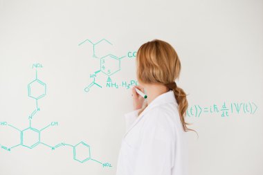 Blond-haired scientist writing a formula on a white board clipart