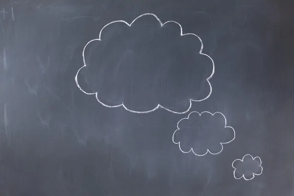 Empty cloud bubbles on a blackboard — Stock Photo, Image