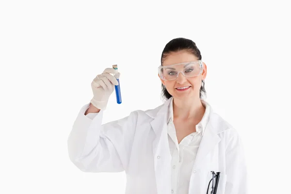 Isolated scientist looking at the camera while holding a test tu — Stock Photo, Image