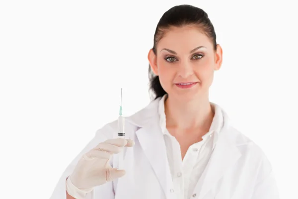 Doctor with syringe looking at the camera — Stock Photo, Image