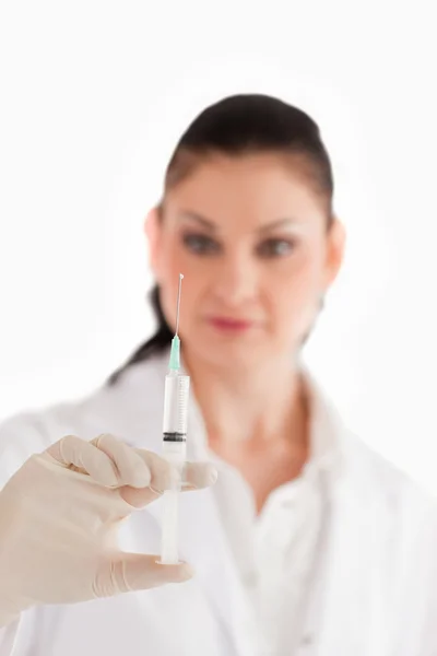 Doctor preparing a syringe — Stock Photo, Image