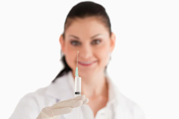 Smiling female doctor preparing a syringe — Stock Photo, Image