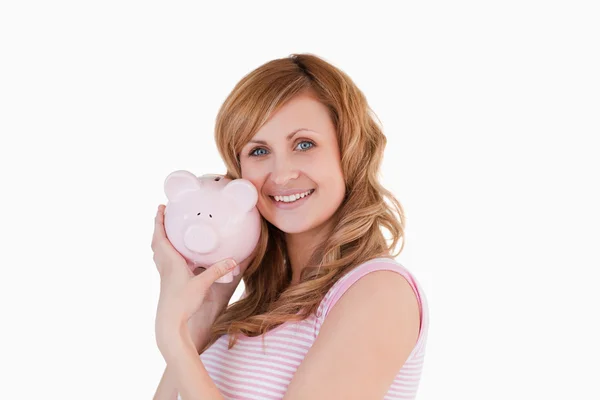Cute woman posing with her piggybank — Stock Photo, Image