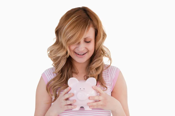 Lovely woman posing while holding her piggybank — Stock Photo, Image