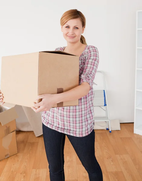 Cute woman carrying cardboard boxes — Stock Photo, Image