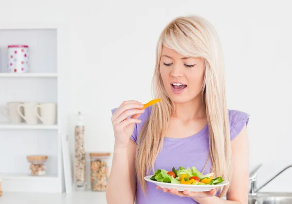 Happy female eating her salad — Stock Photo, Image