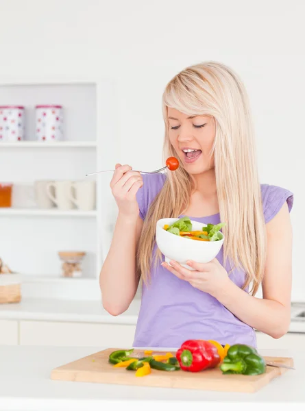 Good looking female eating her salad — Stock Photo, Image