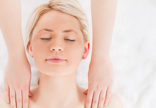 Young blond-haired woman having a massage — Stock Photo, Image