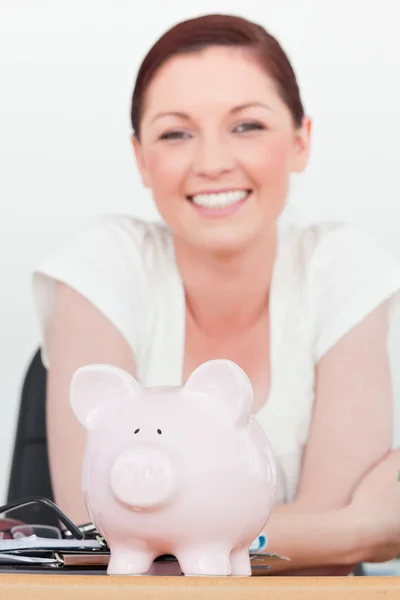 Young beautiful smiling red-haired female posing while sitting i — Stock Photo, Image