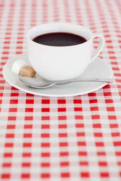 Kaffee auf einer Tischdecke — Stockfoto