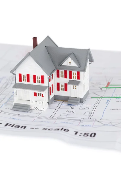 Close-up of toy house model on a plan — Stock Photo, Image