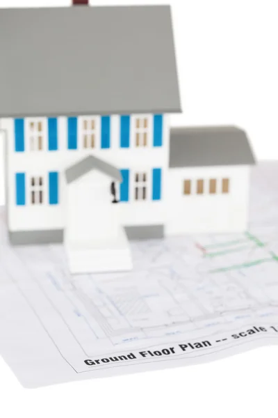 Toy house model on a ground floor plan — Stock Photo, Image