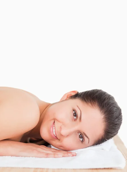 Smilling dark-haired woman in a spa — Stock Photo, Image