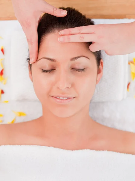 Brunette having a forehead massage — Stock Photo, Image