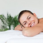 Smiling brunette waiting for a massage — Stock Photo #10602935