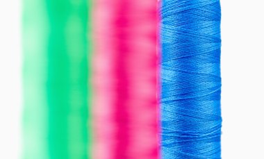 Colorful spools of thread clipart