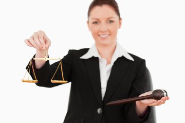 Young woman holdind the justice symbols clipart