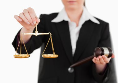 Woman holding a gavel and scales of justice clipart